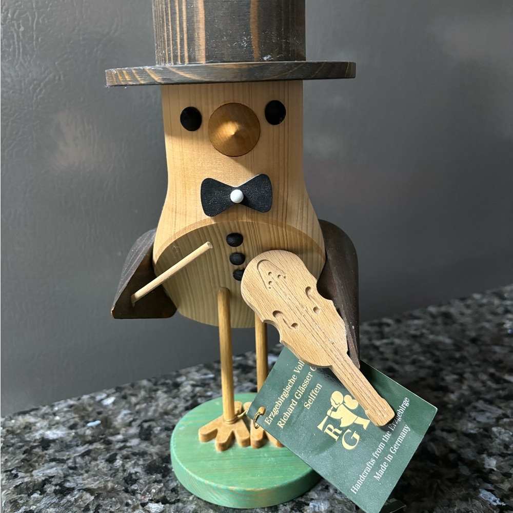 Hand carved wooden bird with violin; made in Germany